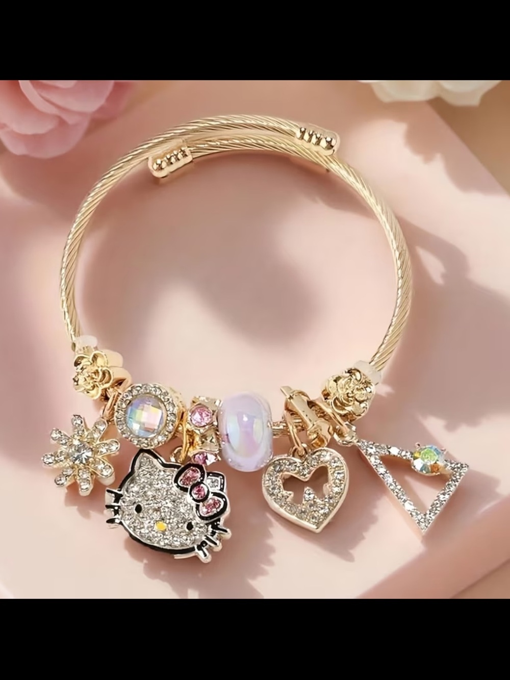 Gold Tone Hello Kitty Charm Bracelet with Pink Accents